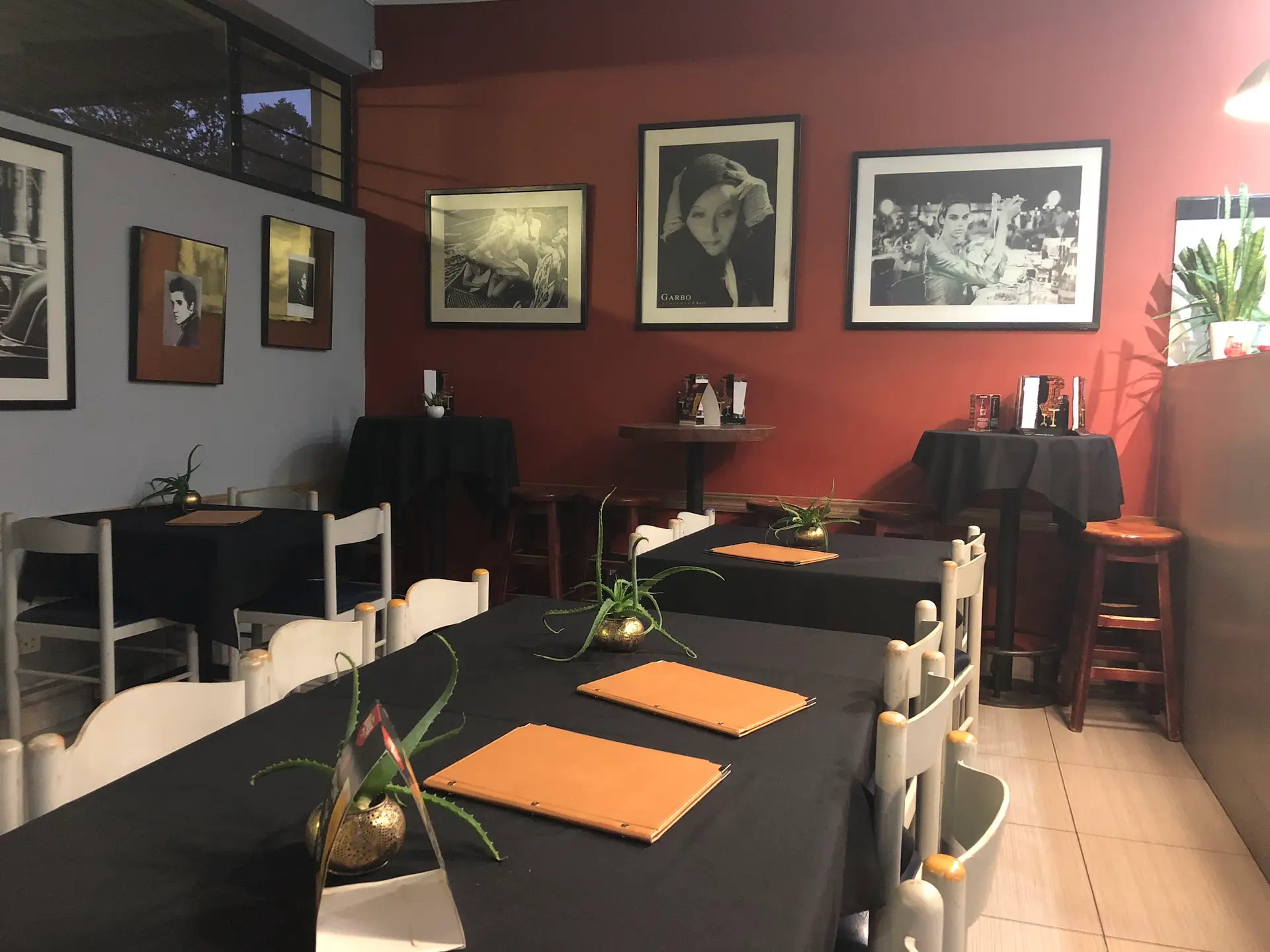 The dining room, with framed photos on the walls