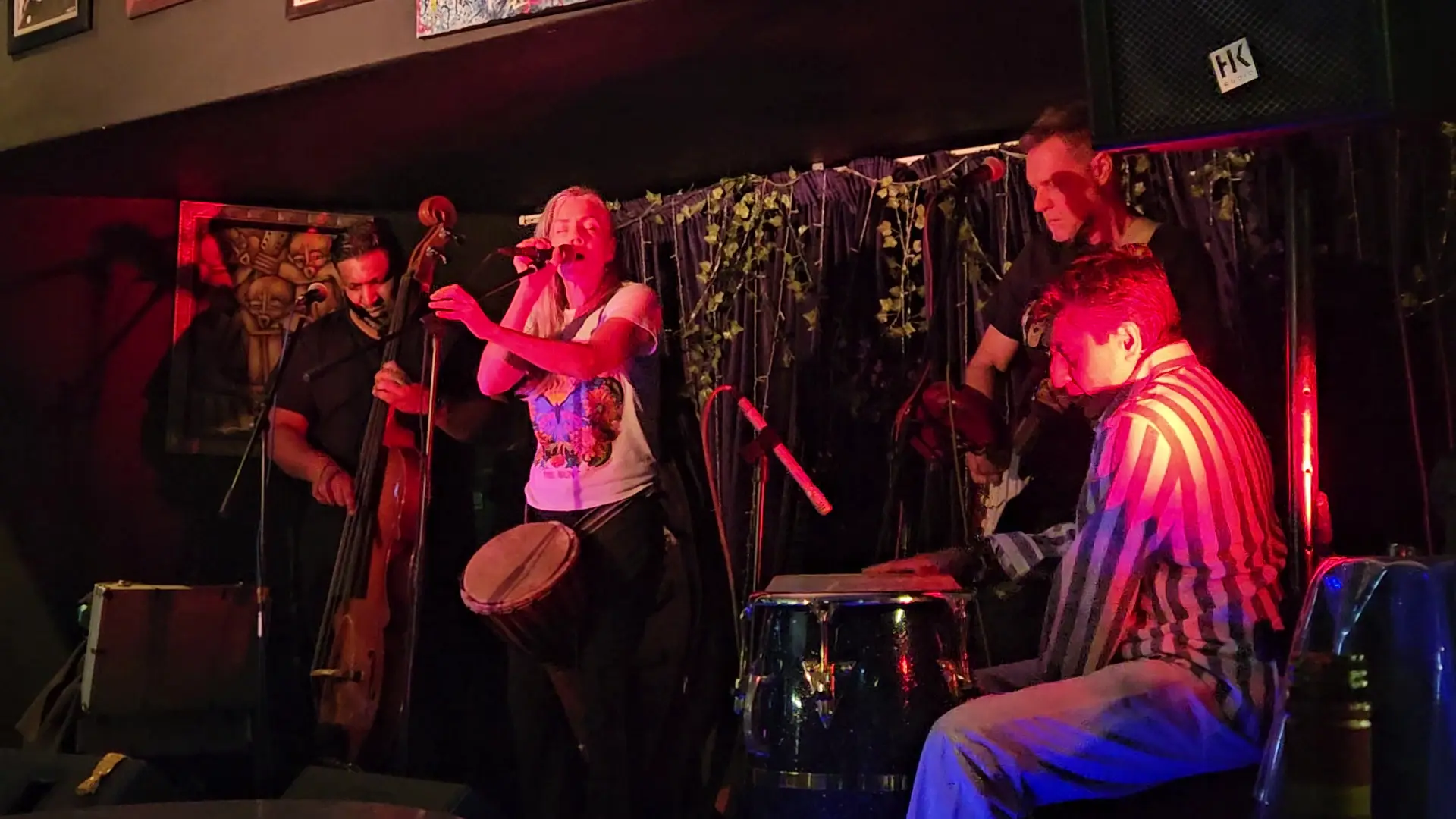 A band on stage in red light